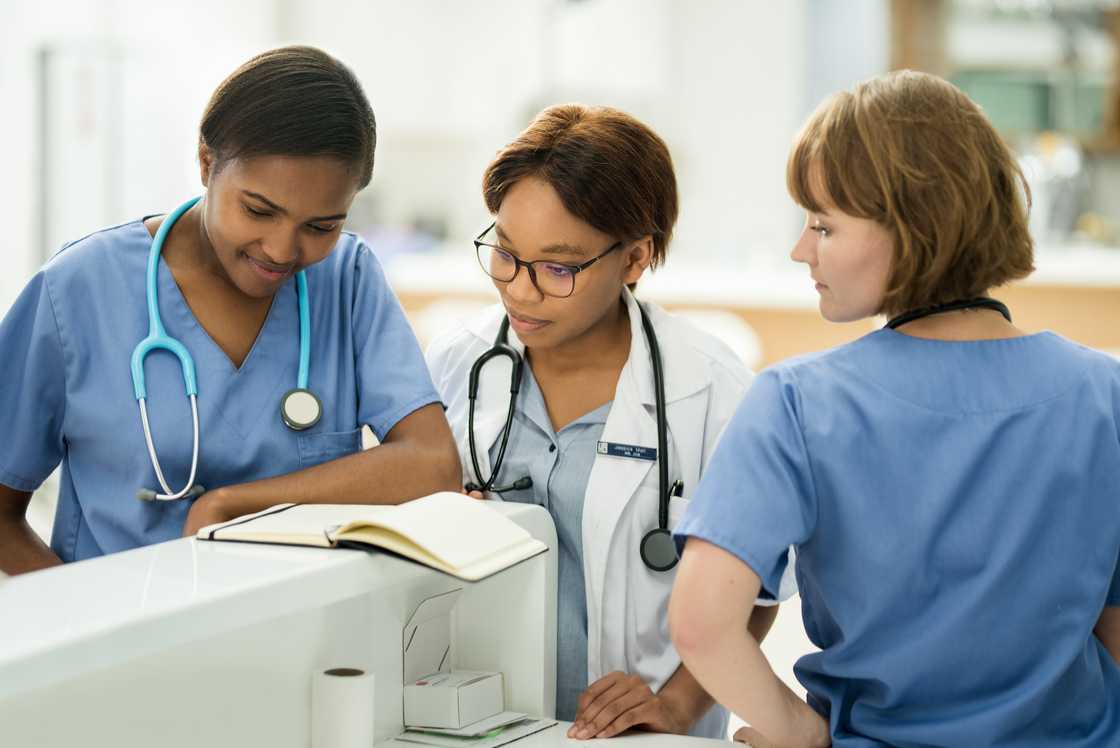 A team of young doctors is closely monitoring the shift