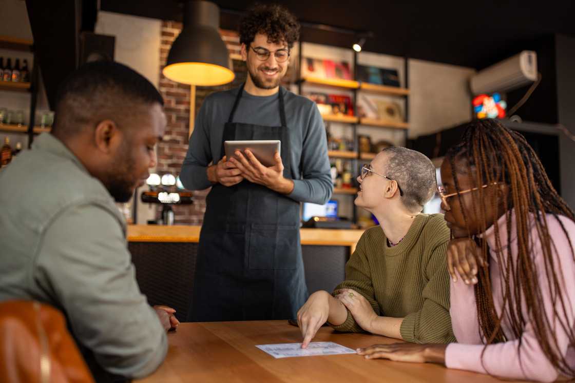 Four people in a cafe
