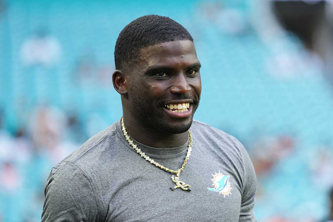 Tyreek Hill of the Miami Dolphins looks on at Hard Rock Stadium Tyreek Hill of the Miami Dolphins looks on at Hard Rock Stadium