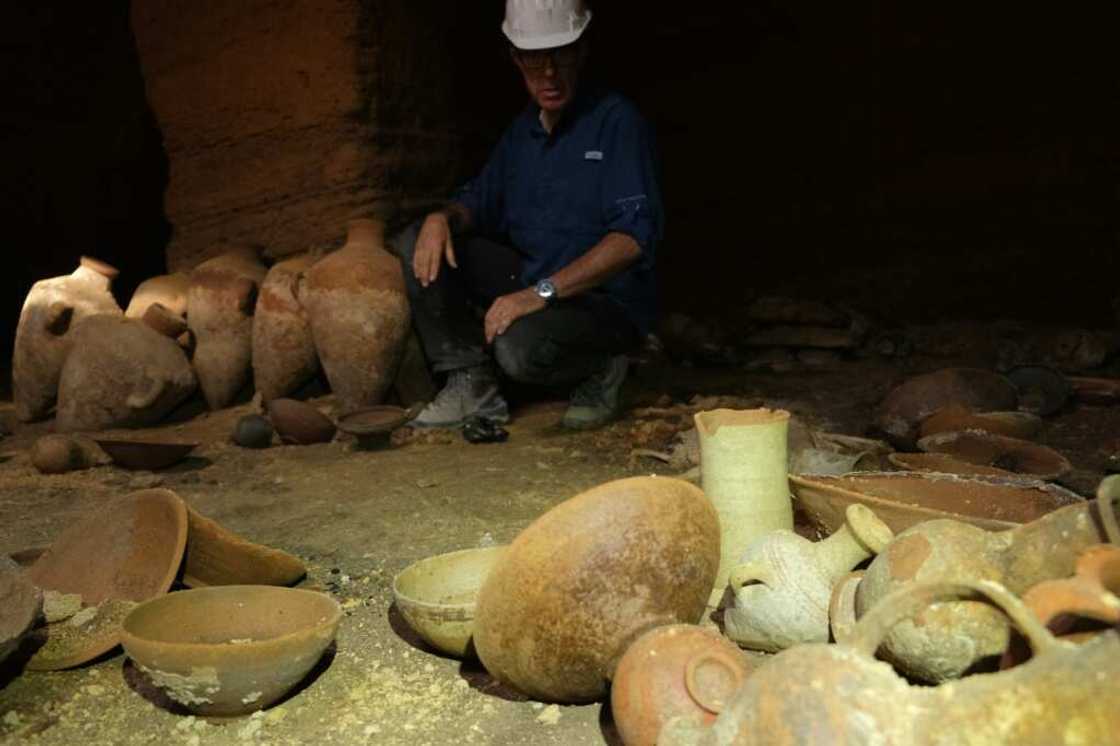 At least one relatively intact skeleton was also found in two rectangular plots in the corner of the cave At least one relatively intact skeleton was also found in two rectangular plots in the corner of the cave