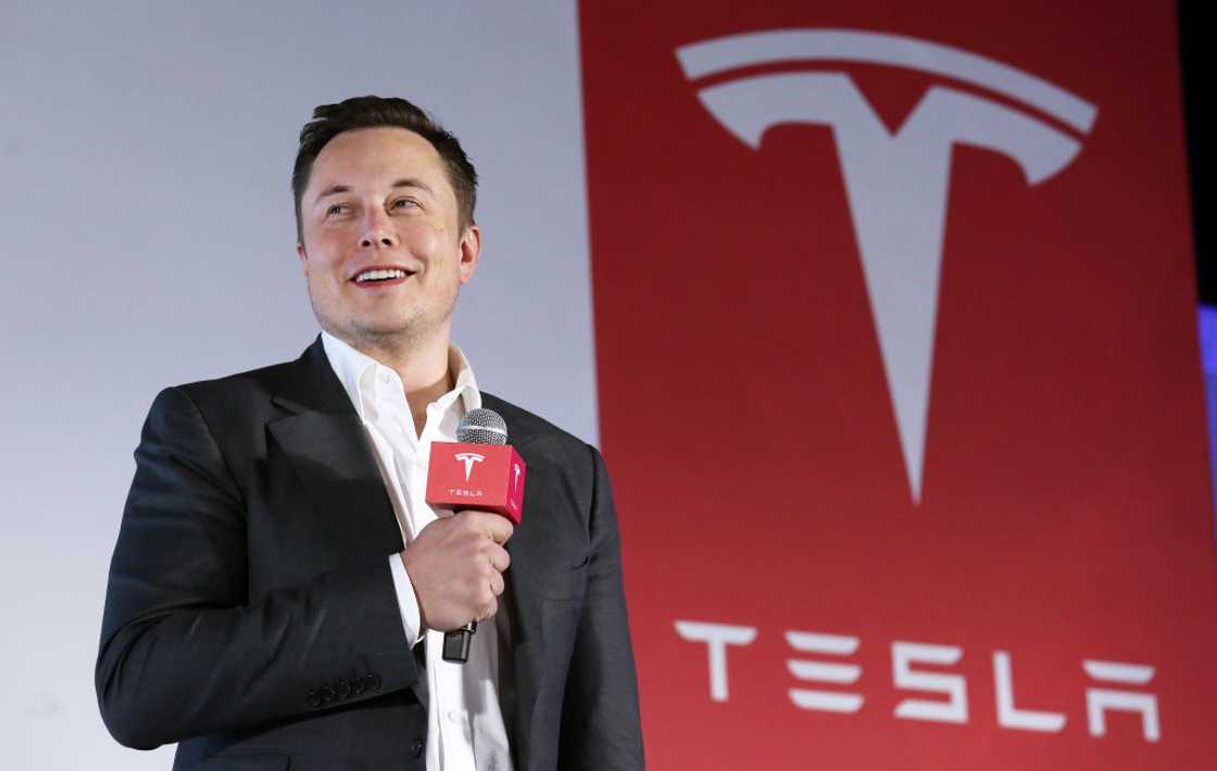 Tesla Motors CEO Elon Musk speaks to the media next to its Model S during a press conference in Hong Kong Tesla Motors CEO Elon Musk speaks to the media next to its Model S during a press conference in Hong Kong