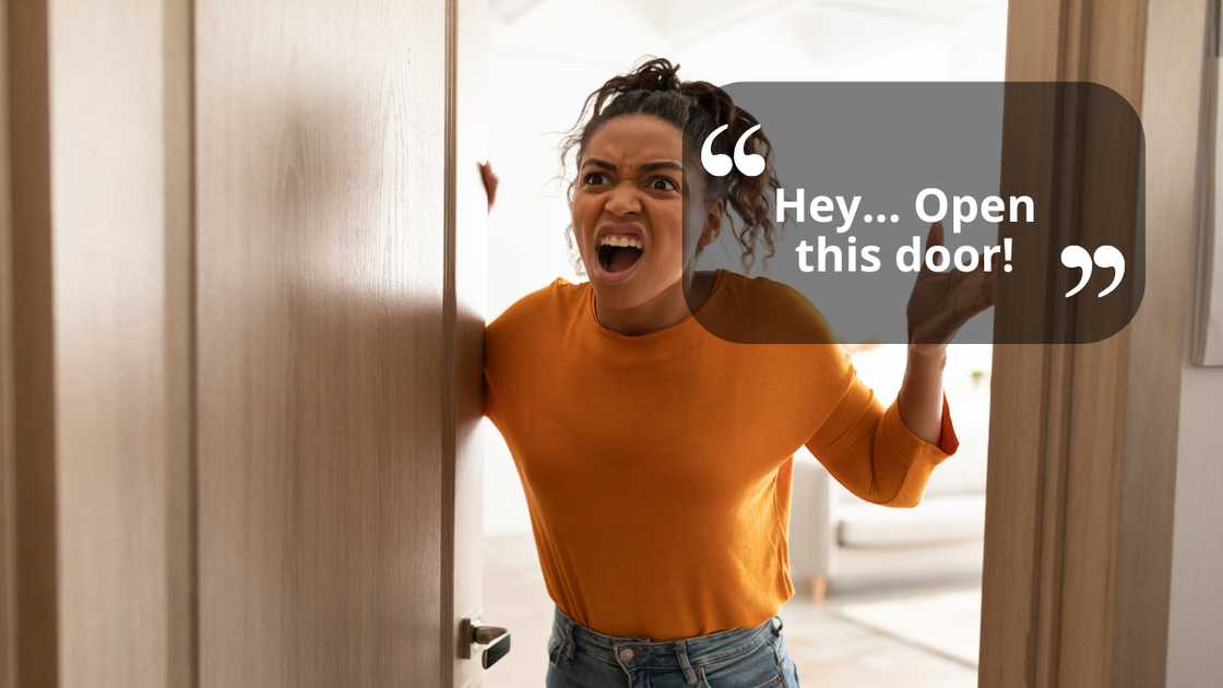 Angy woman standing at the door Angy woman standing at the door