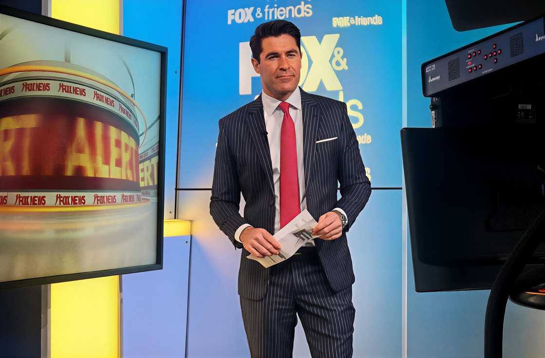 Rob Schmitt poses on set