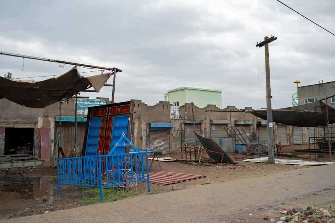 Closed shops in a market near the former US military base in Bagram Closed shops in a market near the former US military base in Bagram
