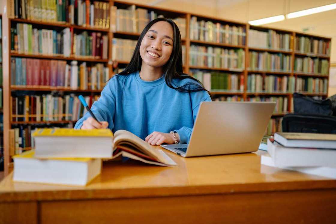 A student in the library studying A student in the library studying