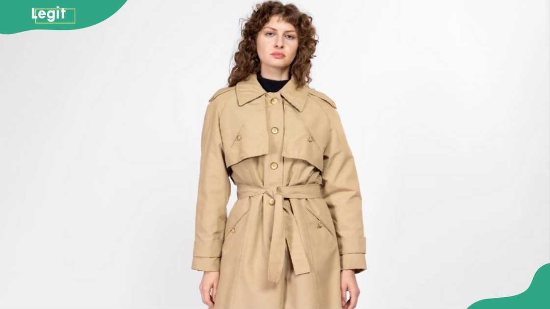 A lady in a belted coat A lady in a belted coat