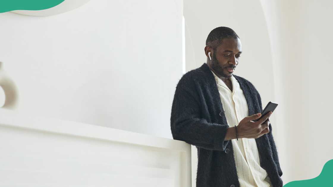 A man looks at his phone