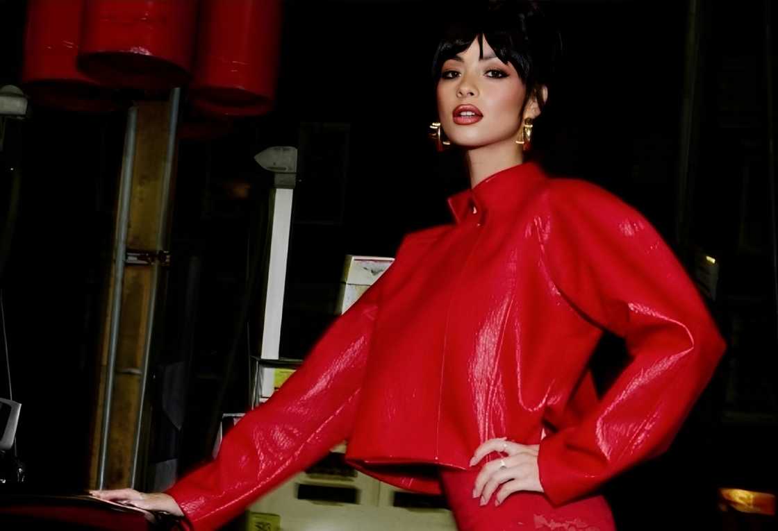 Mishka Silva poses a vibrant red outfit