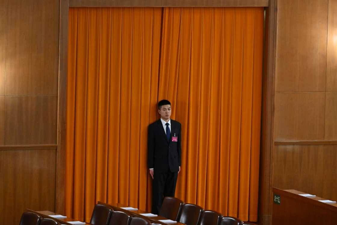Security was tight around the capital, with plainclothes police officers and elderly volunteers in red armbands monitoring for anything that could spoil the tightly-choreographed conclave Security was tight around the capital, with plainclothes police officers and elderly volunteers in red armbands monitoring for anything that could spoil the tightly-choreographed conclave