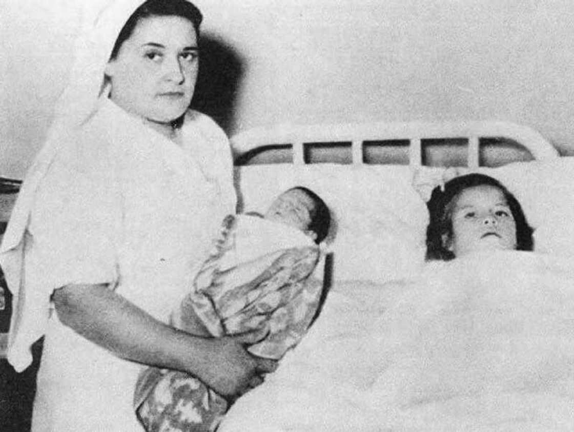 Lina Medina with her midwife after the childbirth