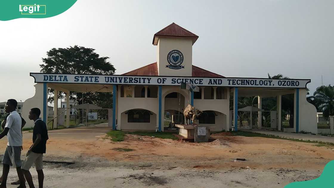 Two young men walking past Delta State Polytechnic, Ozoro Two young men walking past Delta State Polytechnic, Ozoro