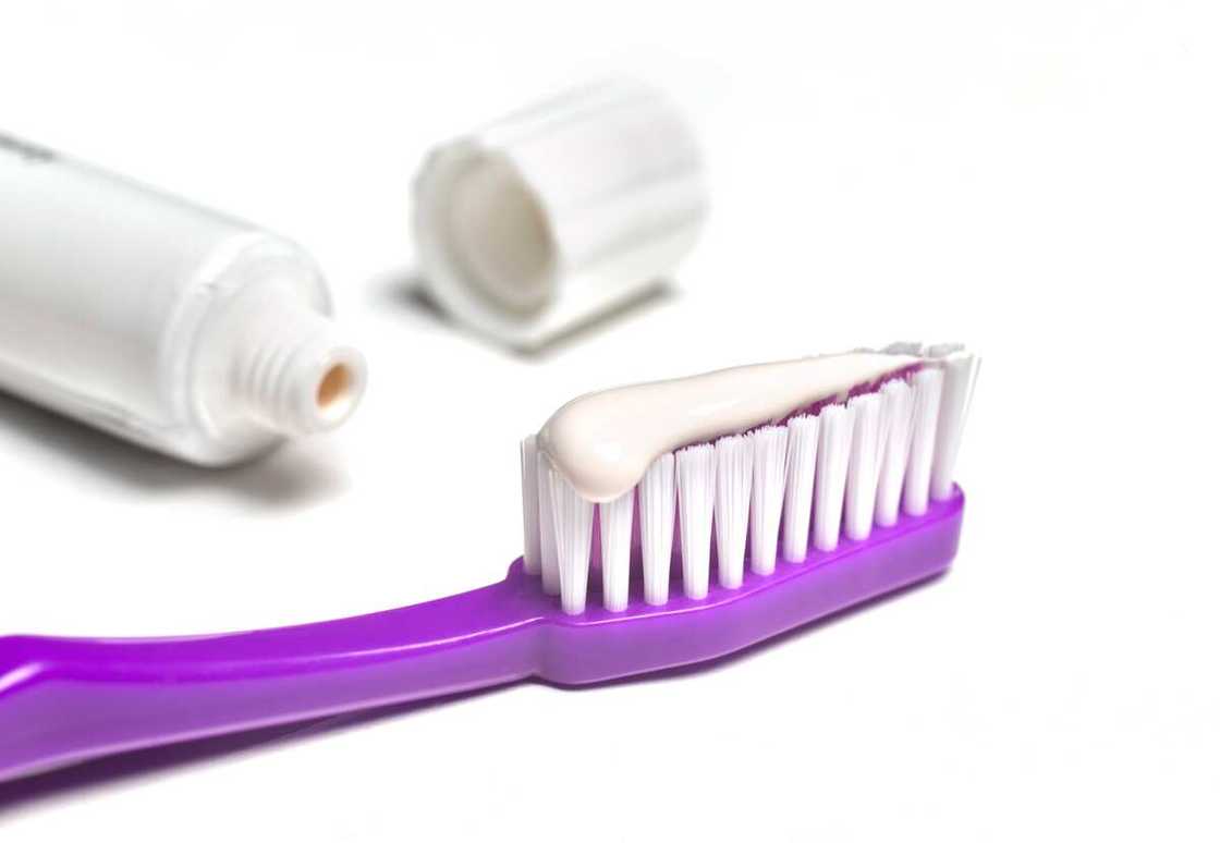 A toothbrush with a toothpaste on it A toothbrush with a toothpaste on it