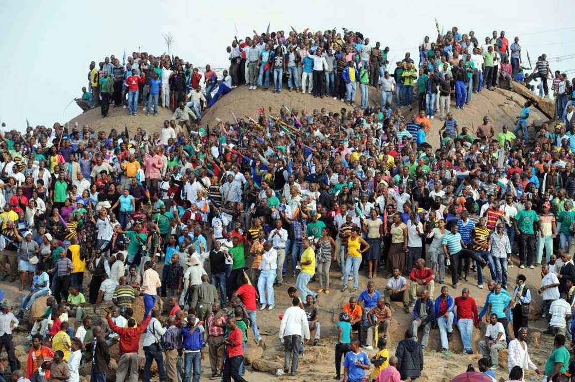 Mourners gather in Marikana on August 23, 2012, to remember those killed during the strike Mourners gather in Marikana on August 23, 2012, to remember those killed during the strike