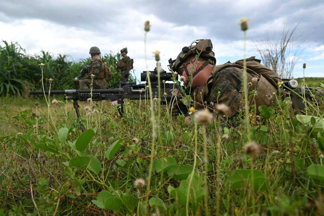 A US marine sniper takes aim during a joint amphibious landing exercise with Philippine counterparts in San Antonio