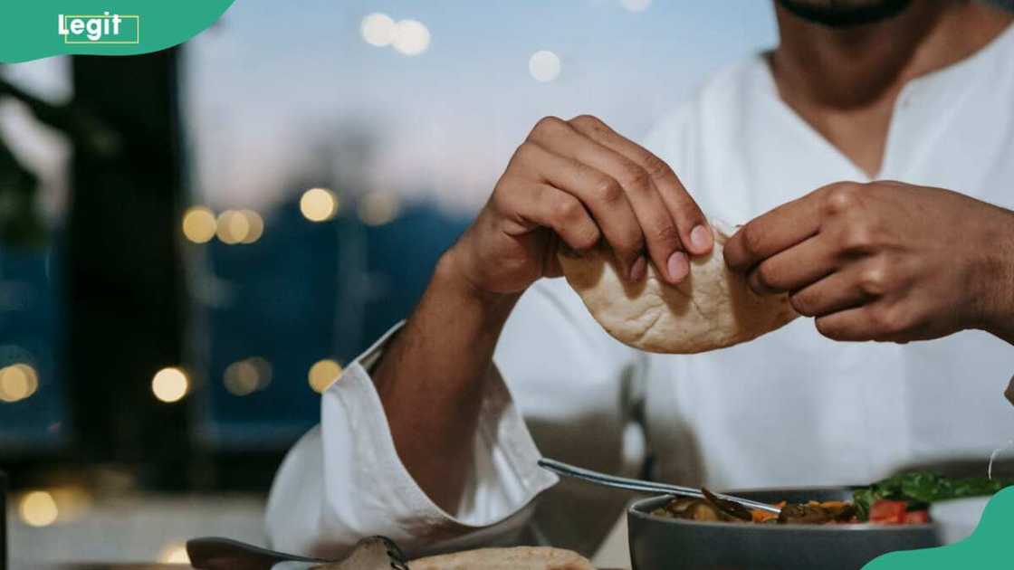 A man eating at a table A man eating at a table