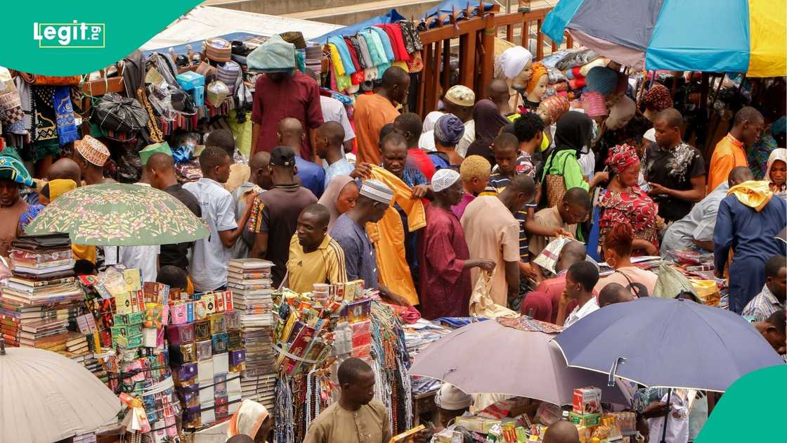 Crowded Nigerian market scene reflecting high cost of living amid economic strain