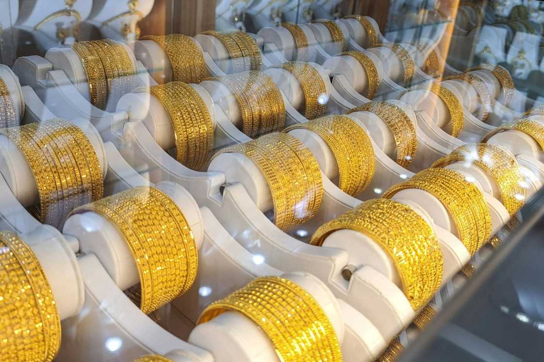 Gold bracelets displayed in a London shop as rising gold prices attract both buyers and sellers