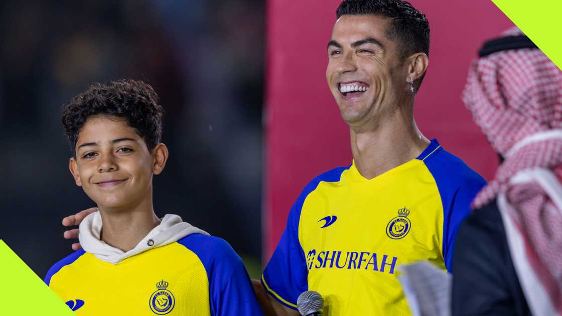 Cristiano Ronaldo shares a hearty laugh alongside his son, Cristiano Jr., during his presentation as an Al-Nassr player on January 3, 2023. Photo by Yasser Bakhsh.