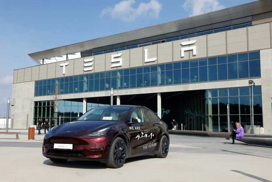 A Tesla car stands in front of the company's electric car plant in Gruenheide near Berlin, Germany, on March 13, 2024