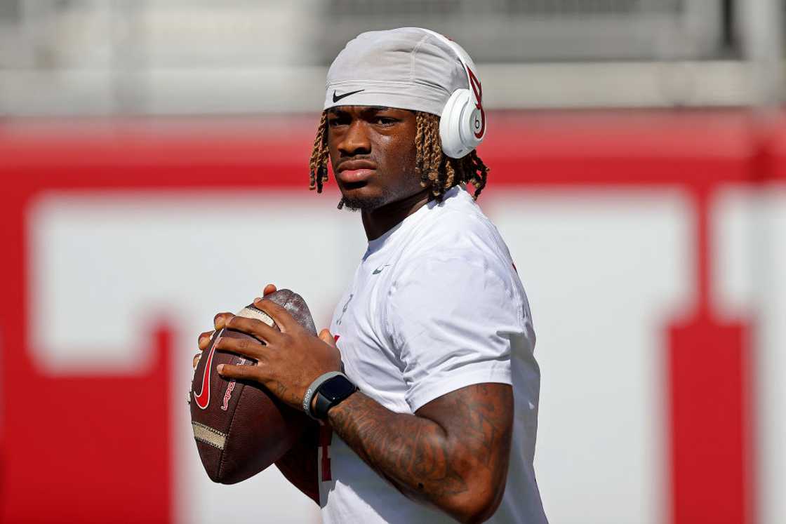 Quarterback Jalen Milroe of the Alabama Crimson Tide warms up