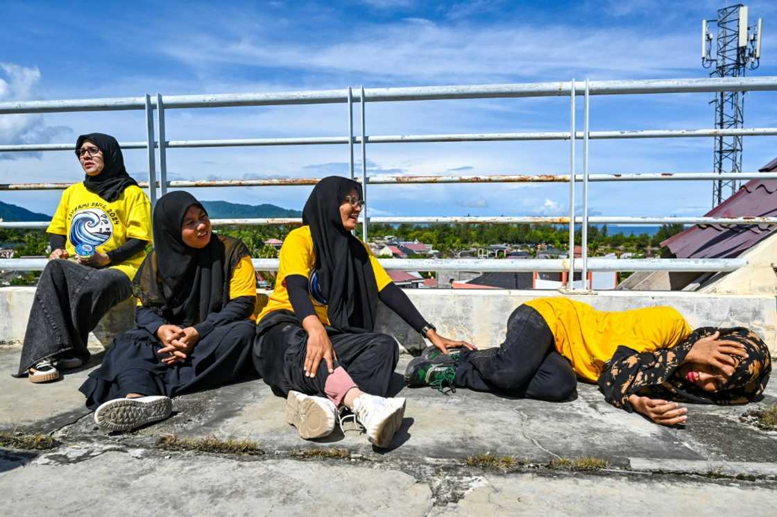 People in Banda Aceh participate in earthquake and tsunami drills ahead of the 20-year anniversary of the 2004 Indian Ocean tsunami disaster. People in Banda Aceh participate in earthquake and tsunami drills ahead of the 20-year anniversary of the 2004 Indian Ocean tsunami disaster.