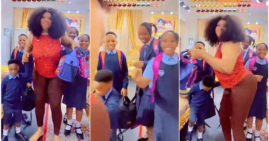 Mum dances happily as school resumes Mum dances happily as school resumes