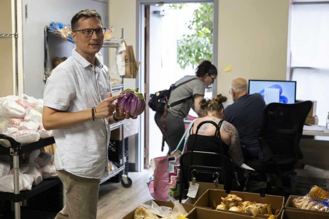 New Bethany Executive Director Marc Rittle inspects fresh produce donated by a local farm to their pantry, in Bethlehem, Pennsylvania, adjacent to Allentown