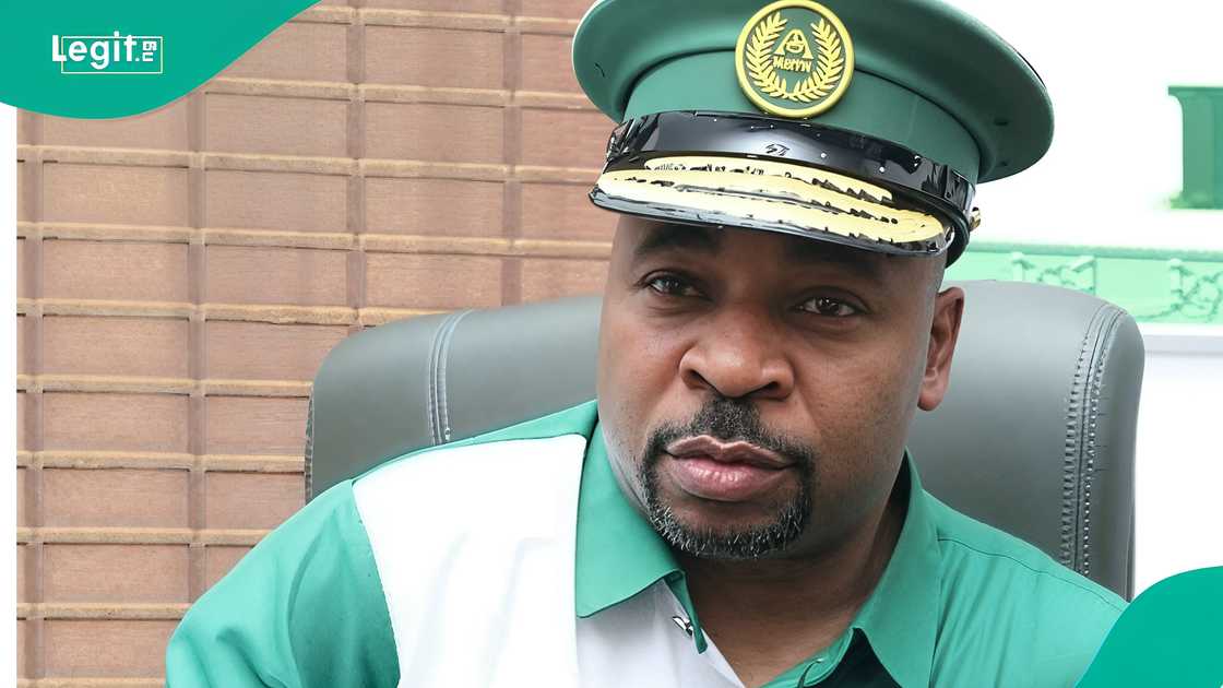 MC Oluomo spotted kissing his wives