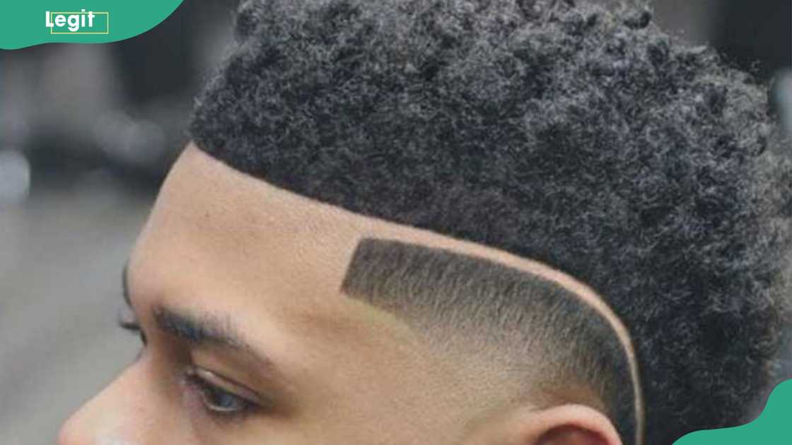 A curly fade with long side part hairstyle A curly fade with long side part hairstyle