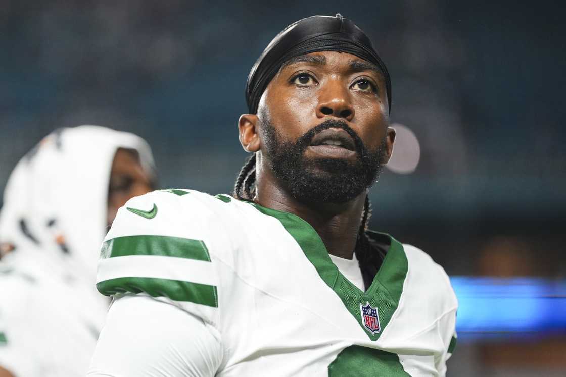 Tyrod Taylor of the New York Jets walks off of the field after an NFL football game against the Miami Dolphins at Hard Rock Stadium in Miami Gardens, Florida