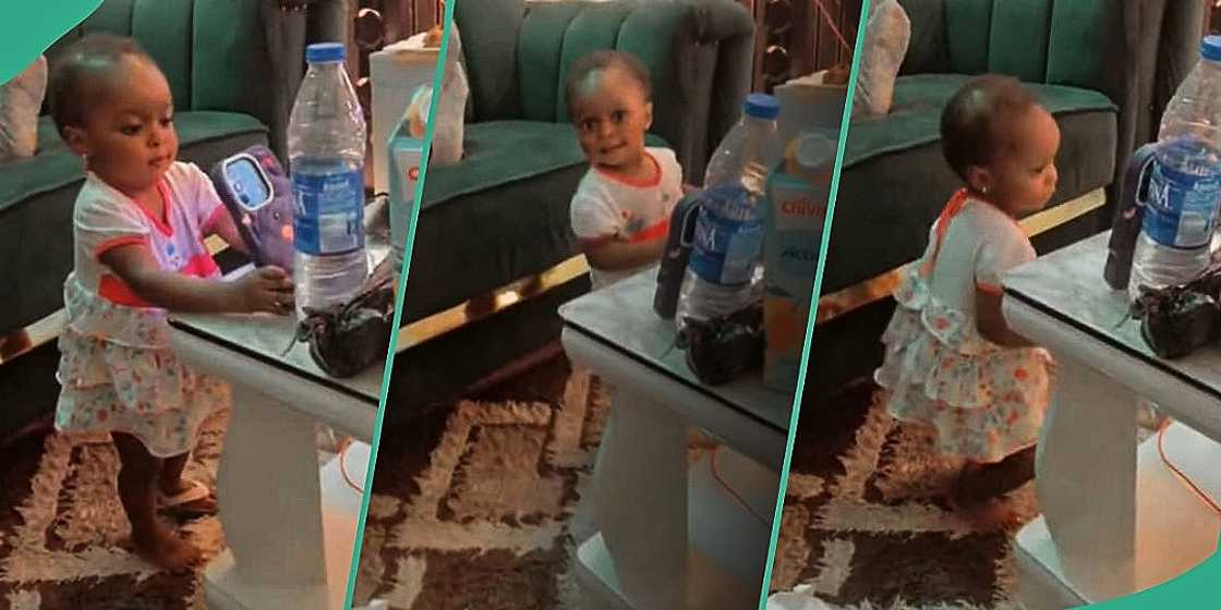 Little girl turns on phone camera to dance Little girl turns on phone camera to dance