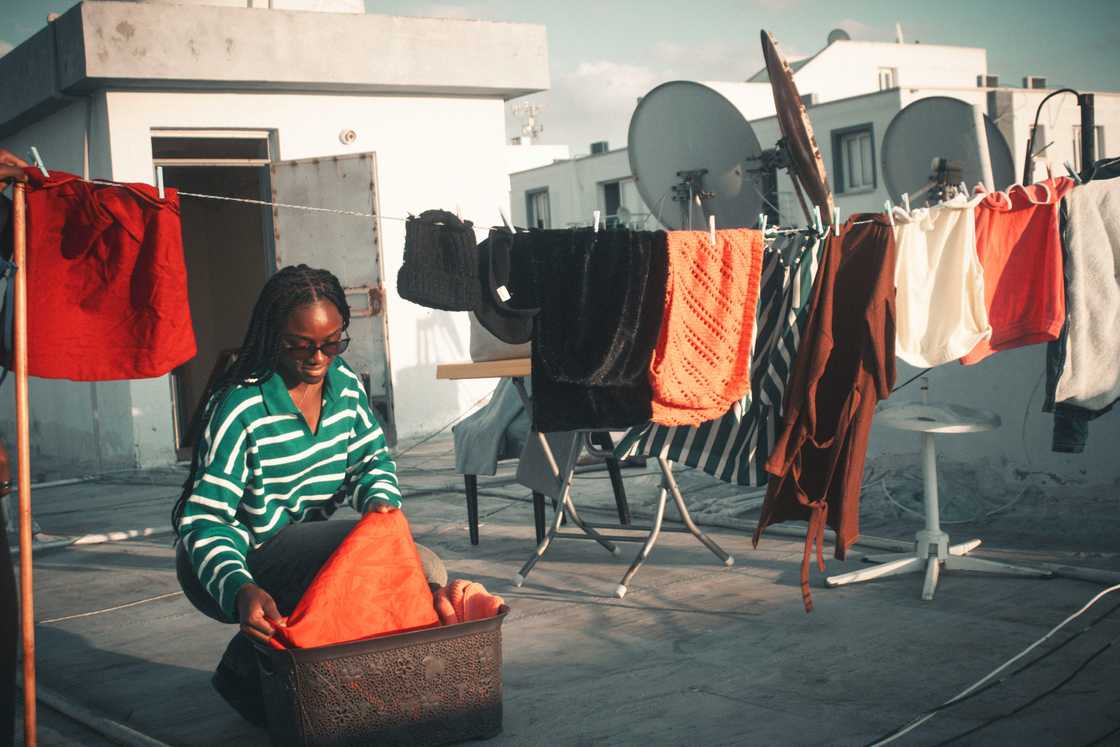 A woman doing her laundry A woman doing her laundry