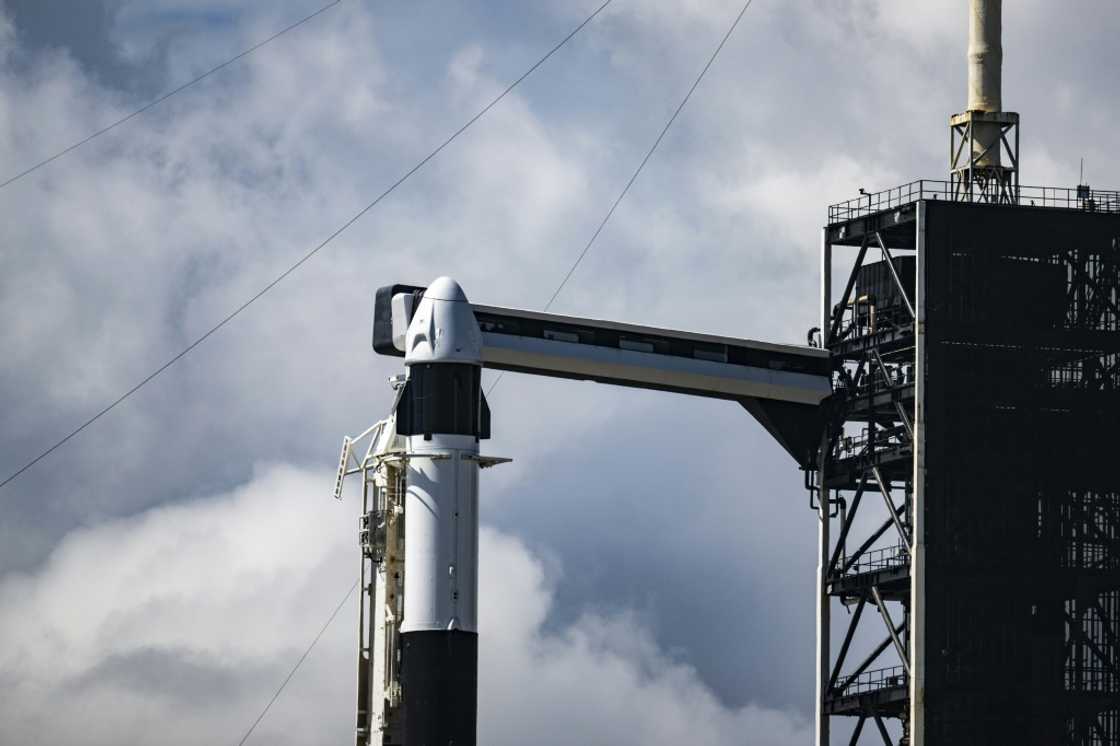 Riding atop a Falcon 9 rocket, the SpaceX Dragon capsule is set to reach a peak altitude of 870 miles (1,400 kilometers) -- higher than any crewed mission in over half a century, since the Apollo era Riding atop a Falcon 9 rocket, the SpaceX Dragon capsule is set to reach a peak altitude of 870 miles (1,400 kilometers) -- higher than any crewed mission in over half a century, since the Apollo era