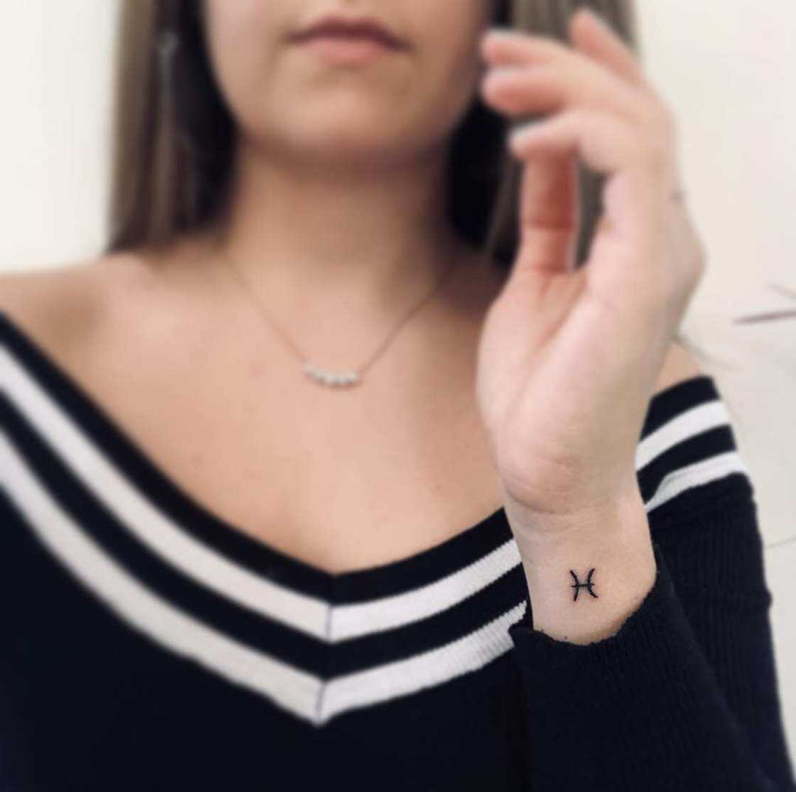 Pisces sign tattoo