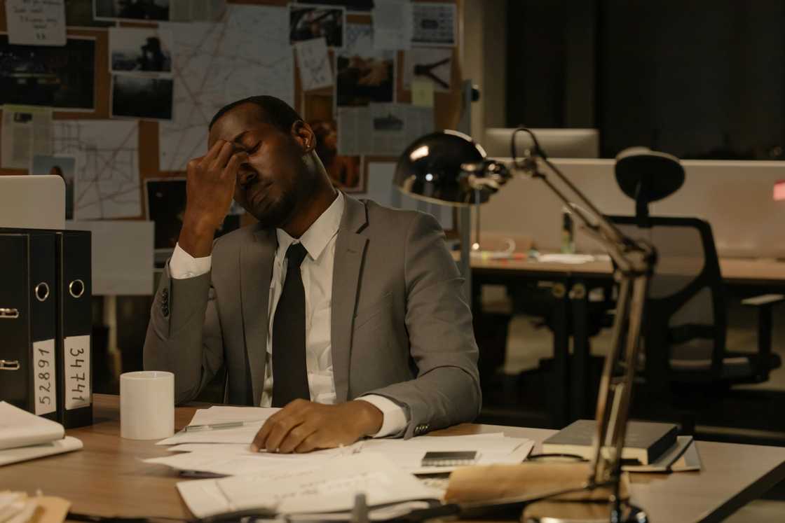 A stressed man in the office at night A stressed man in the office at night