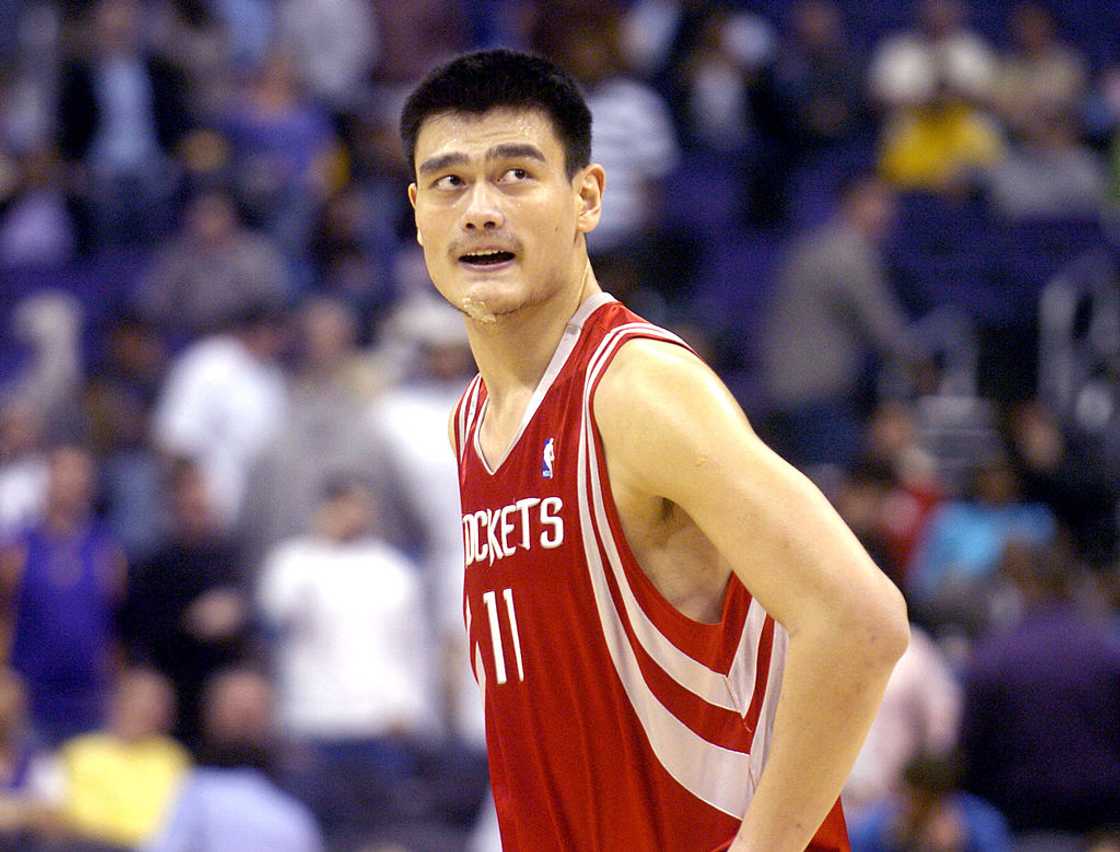 Yao Ming walks onto the court during the NBA game between the Los Angeles Lakers and the Houston Rockets Yao Ming walks onto the court during the NBA game between the Los Angeles Lakers and the Houston Rockets