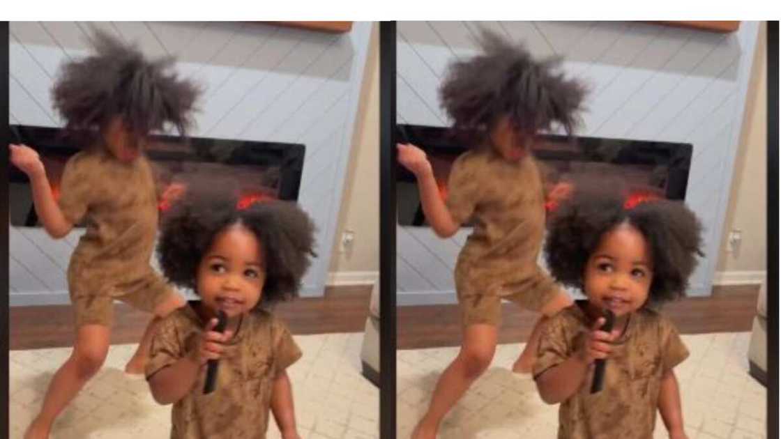 Little girl danced excitedly behind sister Little girl danced excitedly behind sister