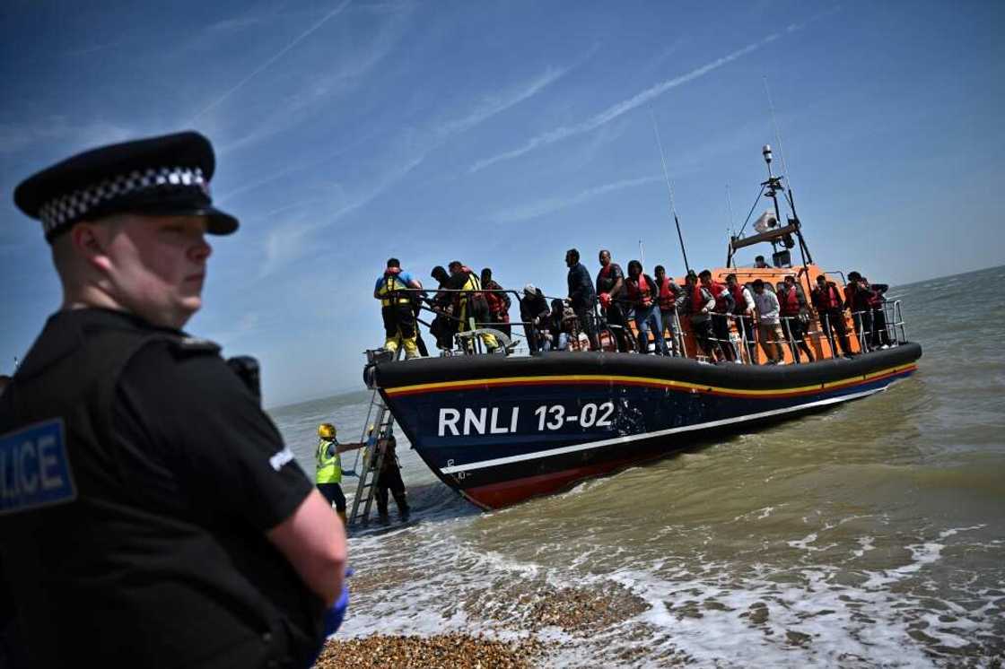 British MPs said there was 'no clear evidence' the government's plan to deport some asylum seekers to Rwanda would discourage Channel crossings