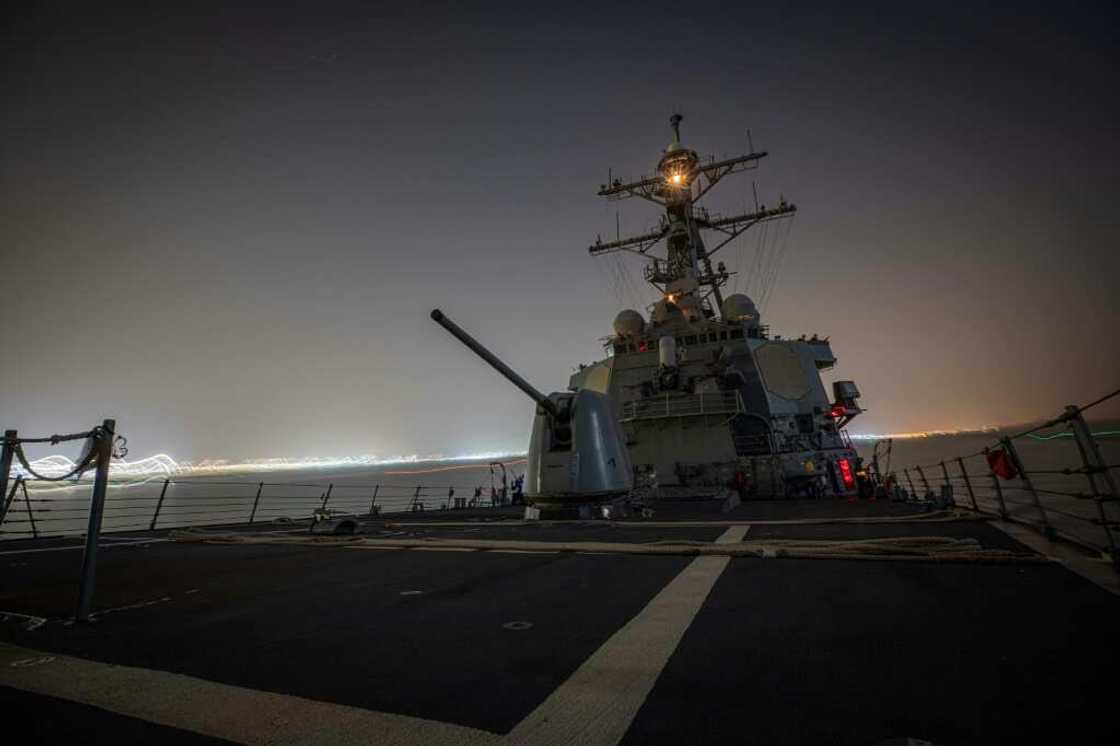 The US guided-missile destroyer USS Carney shot down more than a dozen drones in the Red Sea launched from Huthi-controlled areas of Yemen, defense officials say