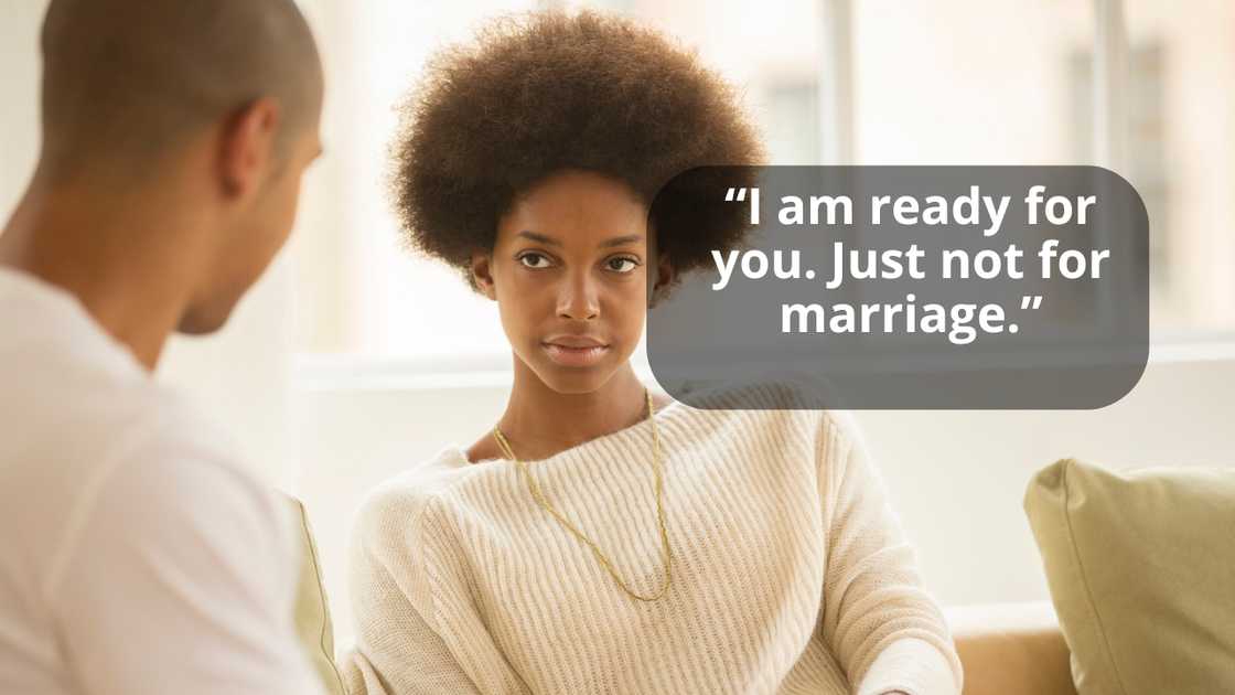 A couple drinking coffee on sofa