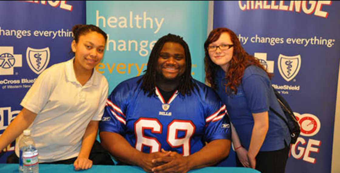 Michael Jasper poses for a photo with two ladies