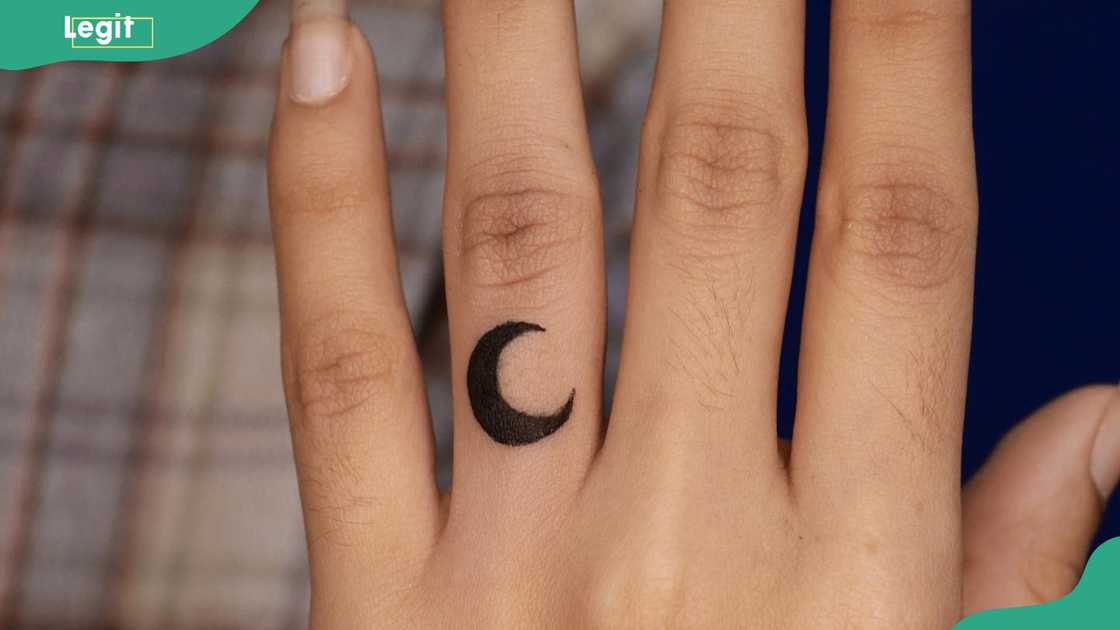 Moon ring tattoo