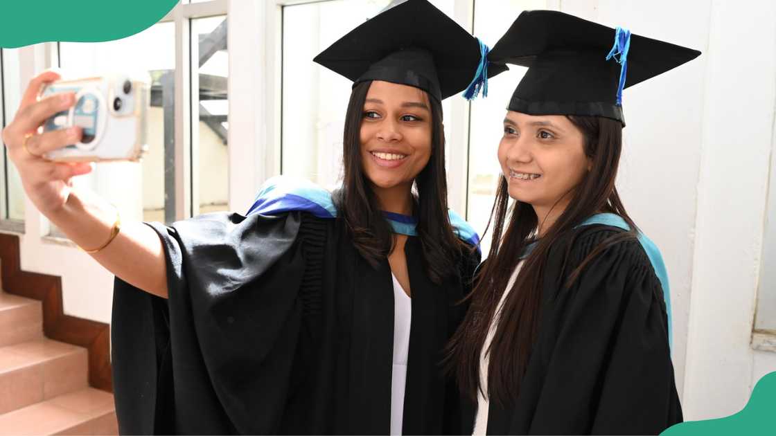 Two female University of Technology, Mauritius graduates.