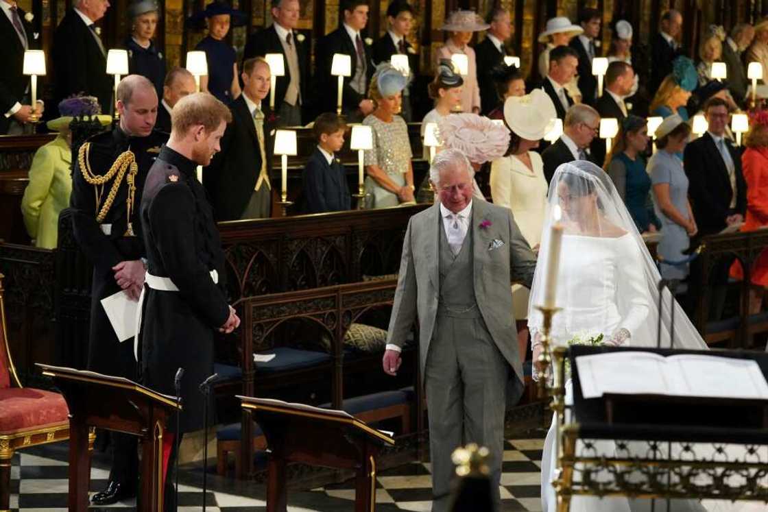 Charles walked Harry's fiancee Meghan Markle down the aisle in 2018 Charles walked Harry's fiancee Meghan Markle down the aisle in 2018