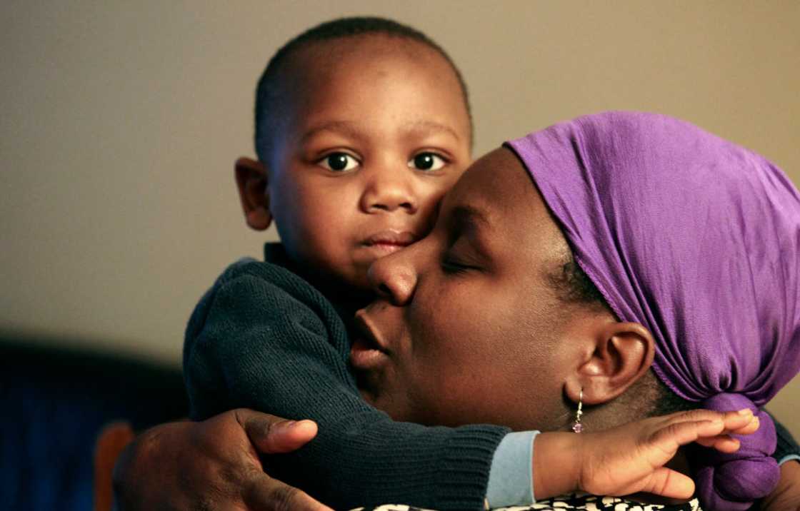 Mother and baby boy holding each other. Mother and baby boy holding each other.