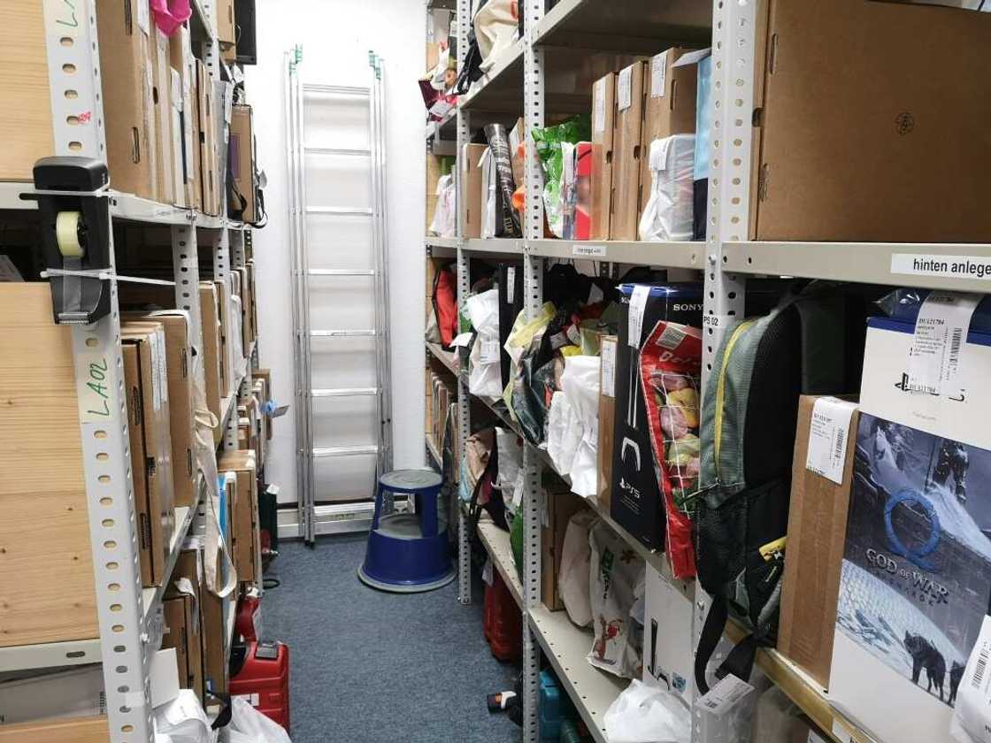 The store room is filled with items traded in for money: mobile phones, electrical devices, televisions, guitars and more The store room is filled with items traded in for money: mobile phones, electrical devices, televisions, guitars and more