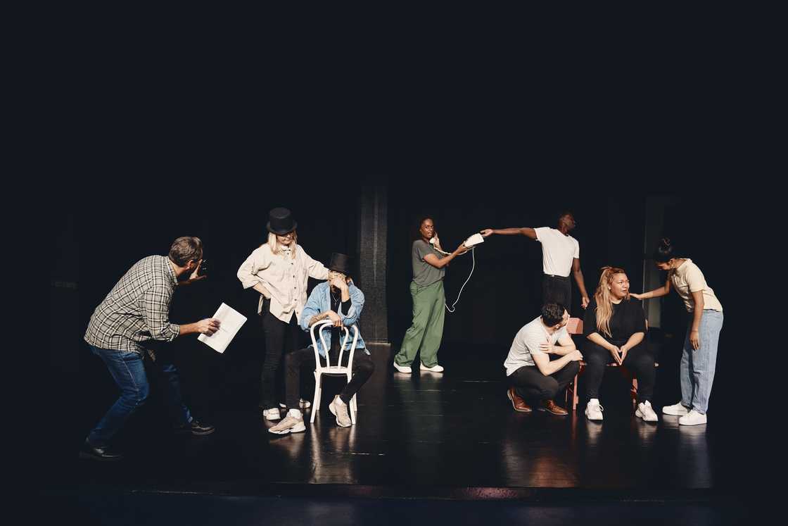 Stage performers practising act together on stage Stage performers practising act together on stage