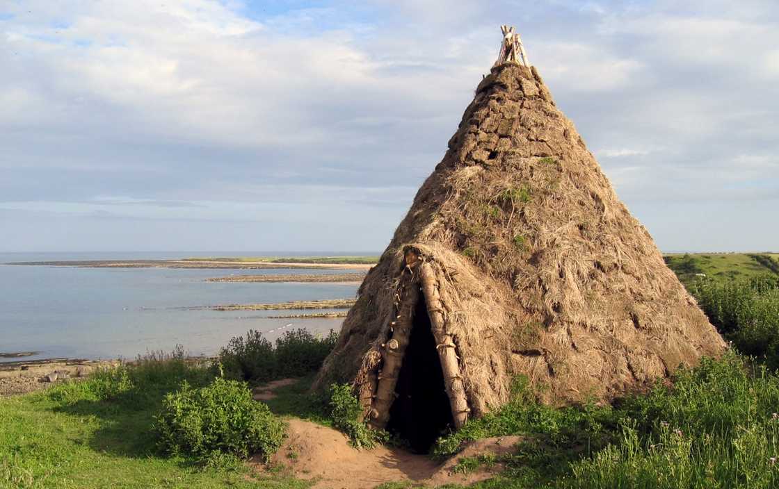 A reconstructed Howick House on a cliff.