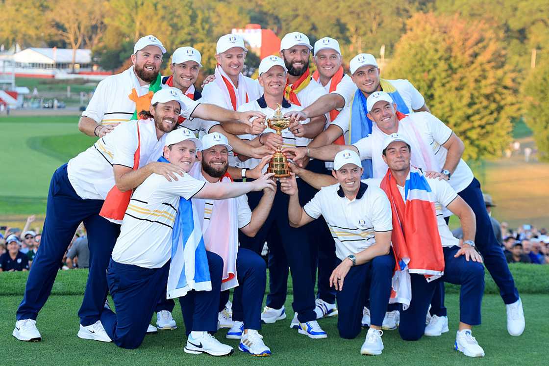 Europe Captain Luke Donald, Shane Lowry, and Team Europe holding the Ryder Cup trophy Europe Captain Luke Donald, Shane Lowry, and Team Europe holding the Ryder Cup trophy