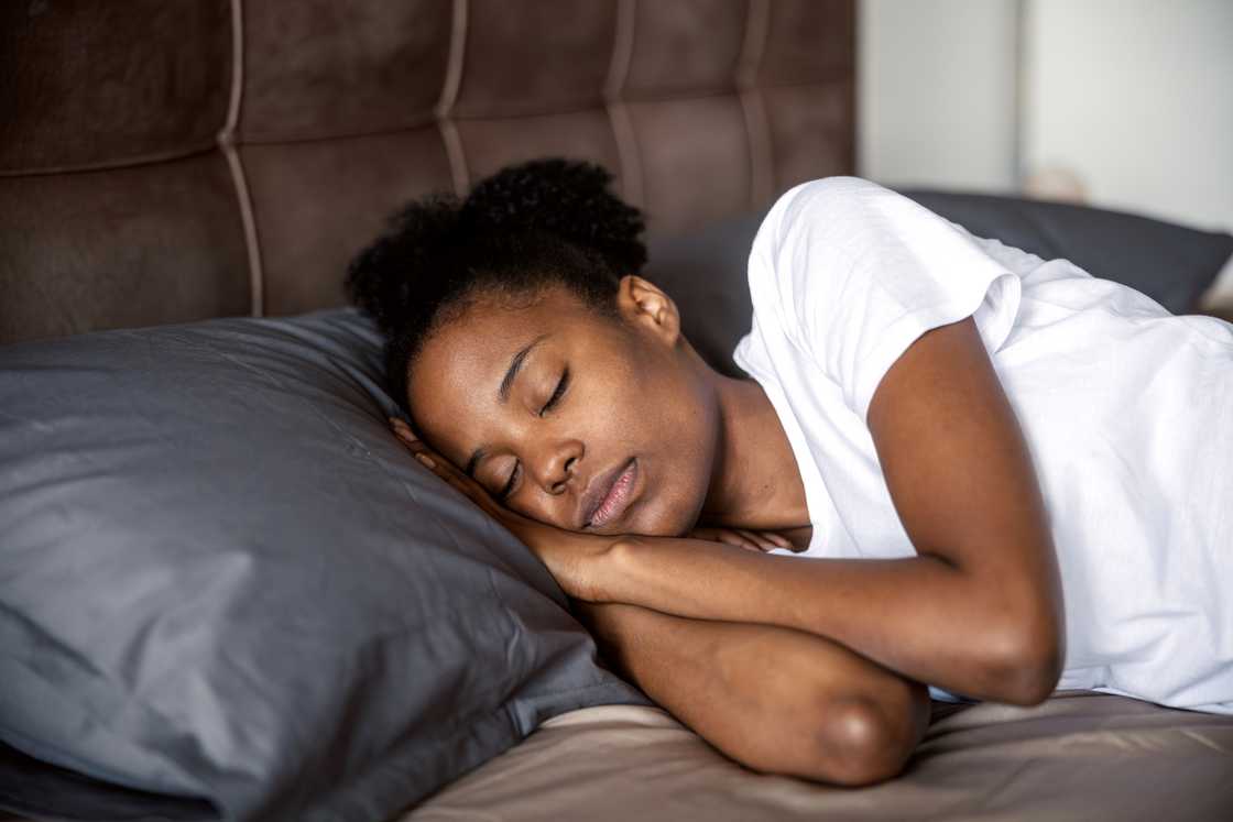 A young black woman peacefully resting A young black woman peacefully resting